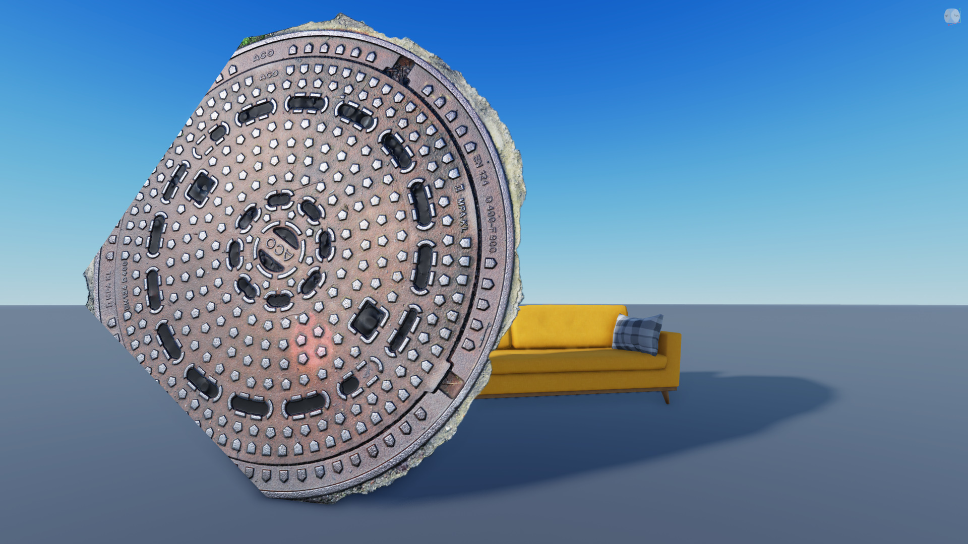 A manhole cover in front of a sofa. The manhole cover has rough edges defined by its texture.